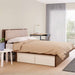 Load image into gallery viewer, Bento walnut storage bed in a modern apartment
