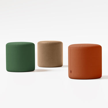 Column poufs in multiple colors in a white room | ff&e dorm furniture manufacturers | Roomy | Chicago